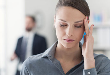 Woman with migraine following an auto accident